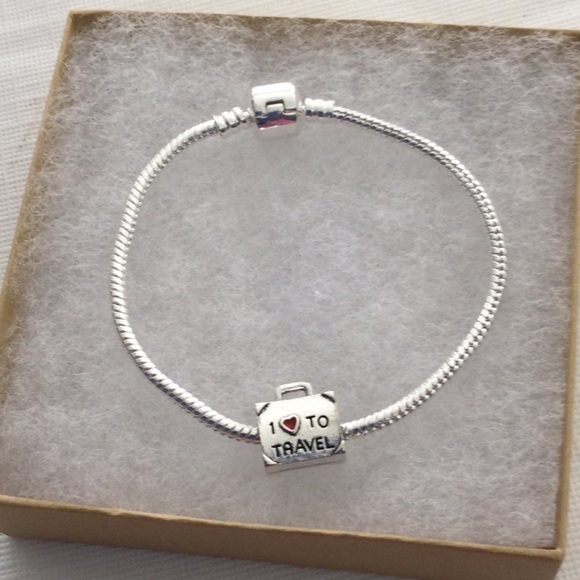 Woman’s Bracelet with one charm that reads I love to travel color sliver.NWOT - Picture 1 of 4